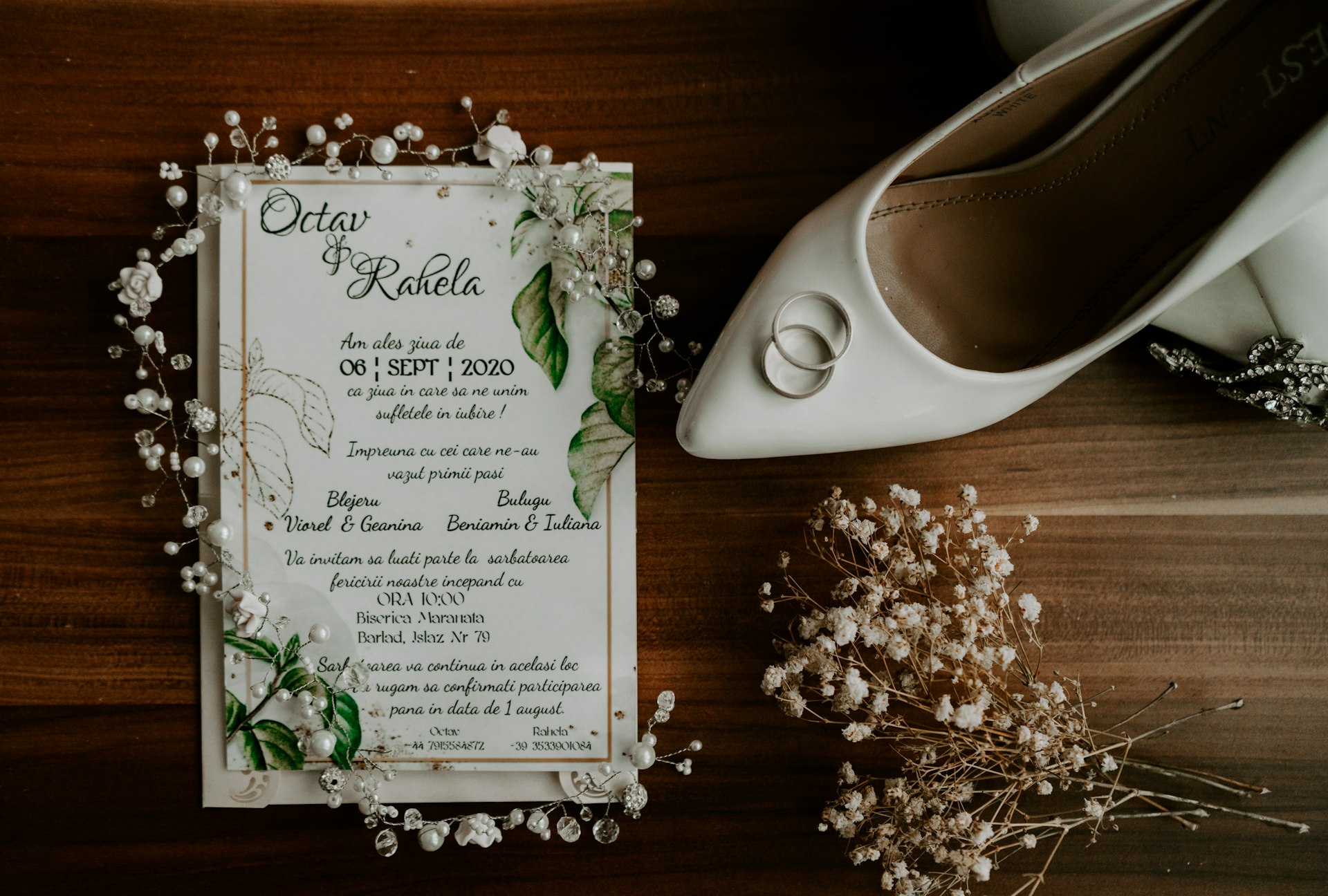 white and green greeting card on brown wooden table